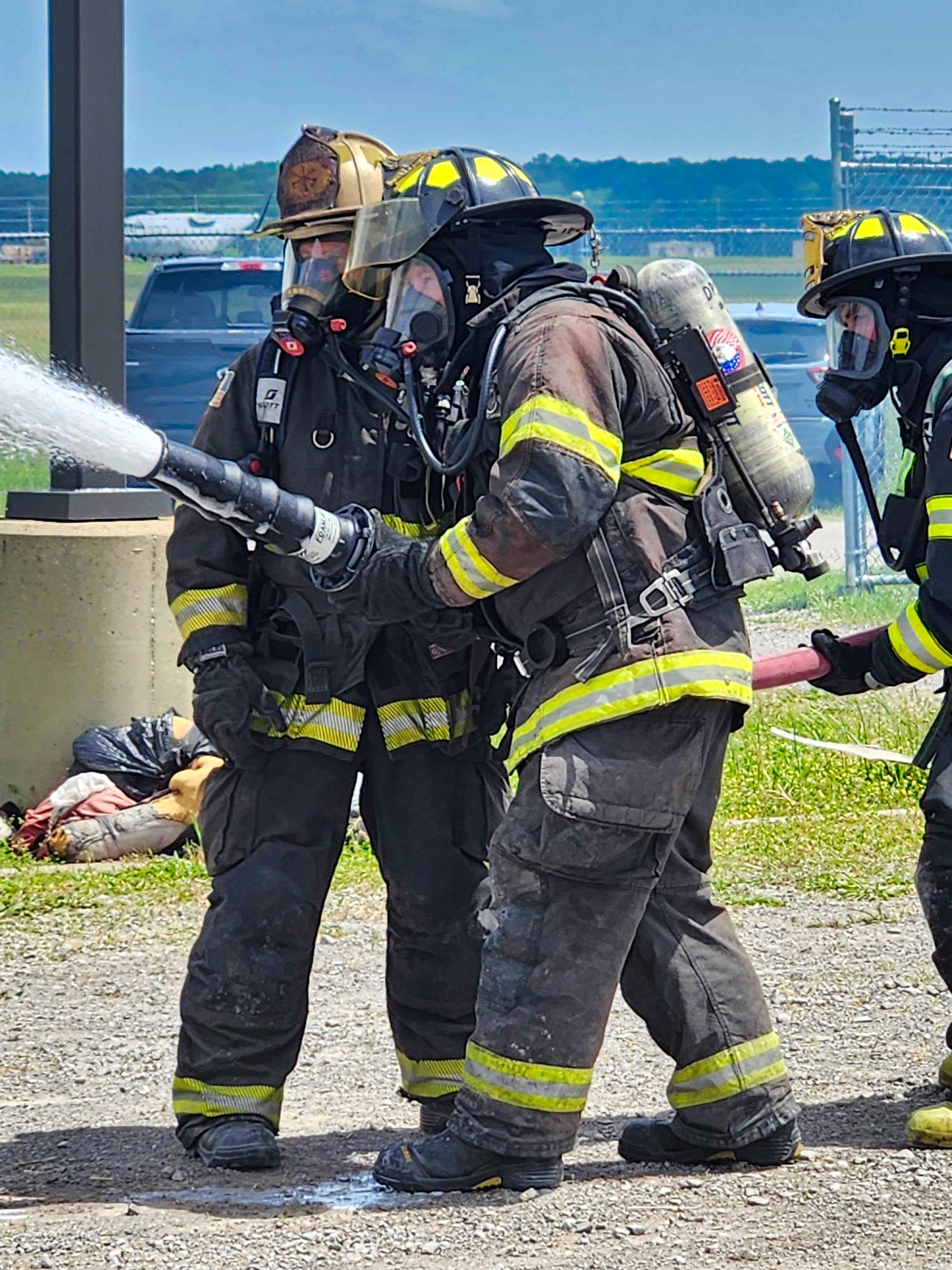 Firefighters training with a hose line