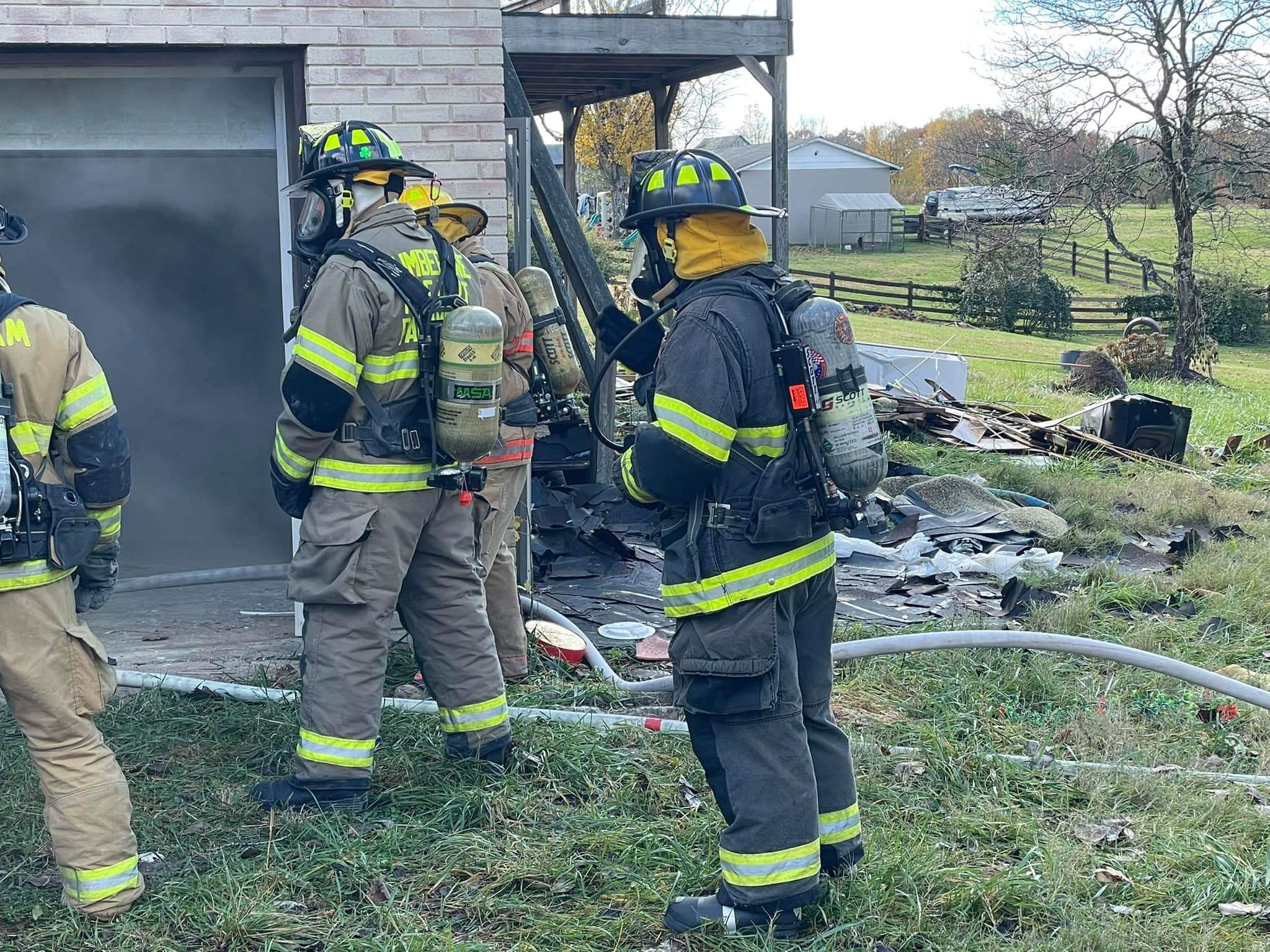 Firefighters operating at a residential scene