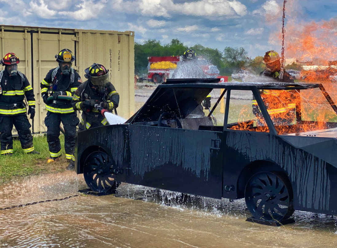 Vehicle fire training exercise with active suppression